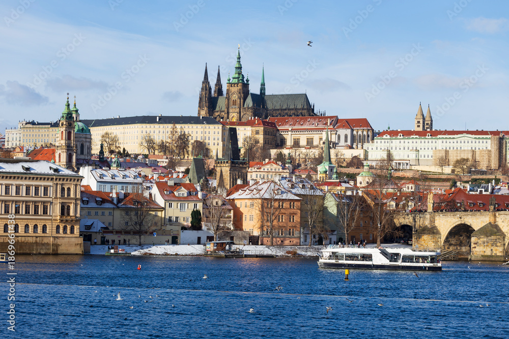 Obraz premium Snowy Prague Lesser Town with gothic Castle, Czech Republic