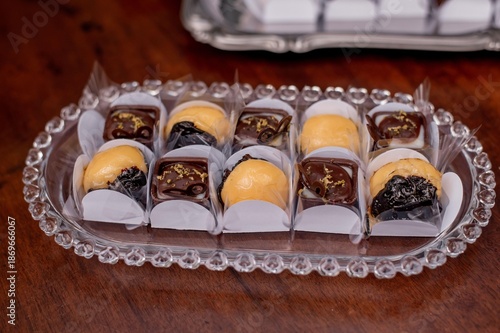 Dessert table with delicious sweets, brigadeiro, data, and coconut