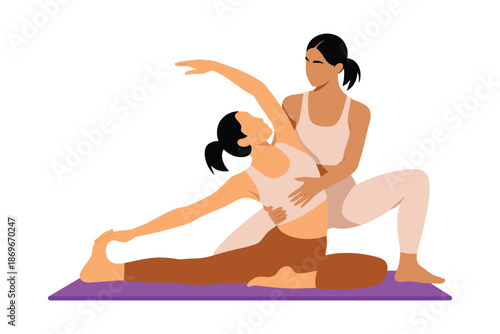 Female yoga instructor gently assists student performing an extended side.
