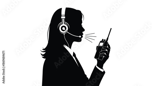 Silhouette of a woman using a headset and handheld radio communication device