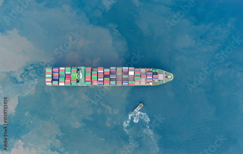 Container ship in export and import business logistics and transportation International. Aerial view and top view. © xiaoliangge