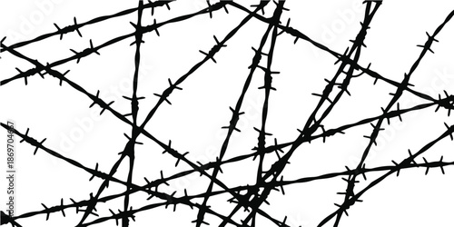 A chaotic tangle of barbed wire creates an abstract and dangerous silhouette pattern