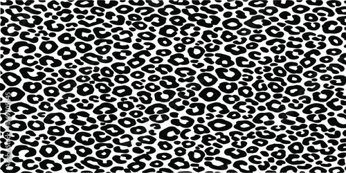 A graphic black and white leopard animal print pattern with a classic monochrome style