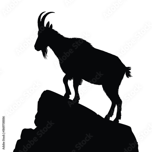 Silhouette of a majestic ibex standing proudly on a rocky outcrop