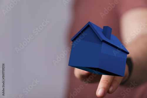 A person's hand supporting ...