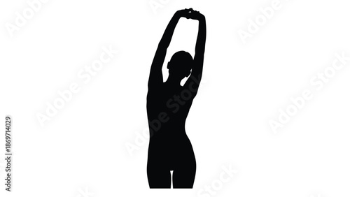 Silhouette image captures the graceful motion of a female figure performing a full body stretch with both arms raised high above her head