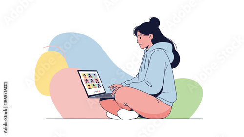 Young woman in casual clothes participating in a video conference on a laptop