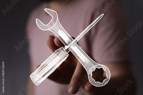 Hand holding digital wrench...