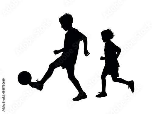 Silhouette of Two Boys Playing Soccer, Kicking Ball in Motion