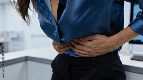 woman having painful stomachache with hands holding pressing her crotch lower abdomen. healthcare concept