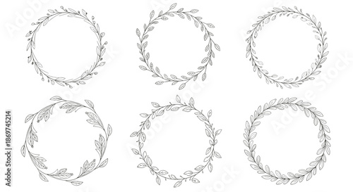 Set of six black and white floral wreaths with intricate leafy patterns perfect for wedding invitations and stationery.