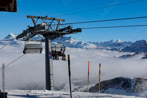 Ski resort with skiers ridi...
