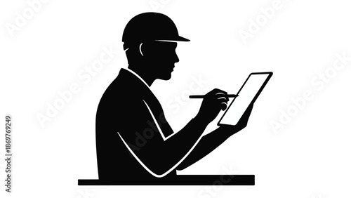 Black silhouette of a man in a cap working on a tablet computer with a stylus in a modern workspace setting