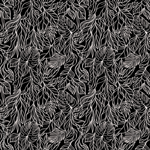 A seamless tropical pattern with a variety of tropical 
leaves. The foliage includes banana and monstera leaves. Botanical wallpaper.