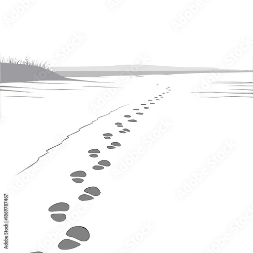 Footprints leading into distant white fog on sandy beach