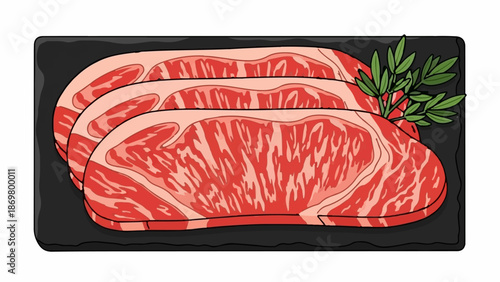 Three marbled raw steaks arranged on a dark rectangular platter with a sprig of greenery