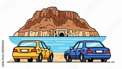 Two cars parked on a beach facing a vast body of water with a large rock formation behind