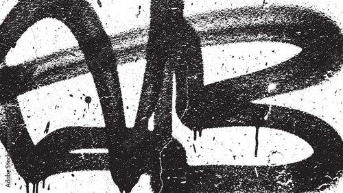 Black graffiti tag on a white wall with paint drips and splatters.