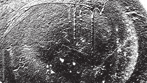 Closeup of a textured surface with dripping liquid creating an abstract pattern.