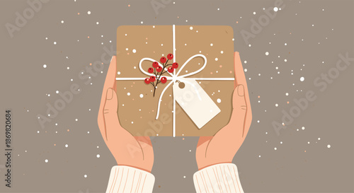 Human hands holding a beautifully wrapped Christmas gift box decorated with red berries and a festive white name tag.