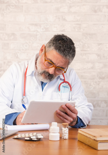 Doctor using digital tablet for medical consultation and prescription