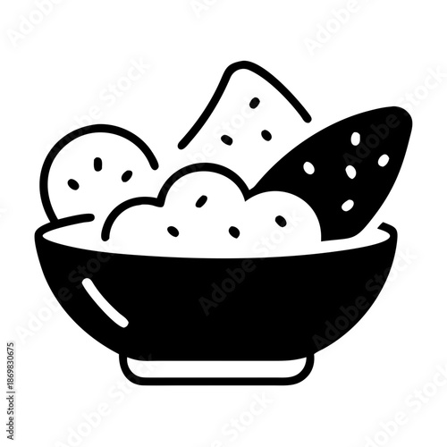 A black and white icon depicting a bowl of creamy dip with tortilla chips for a snack