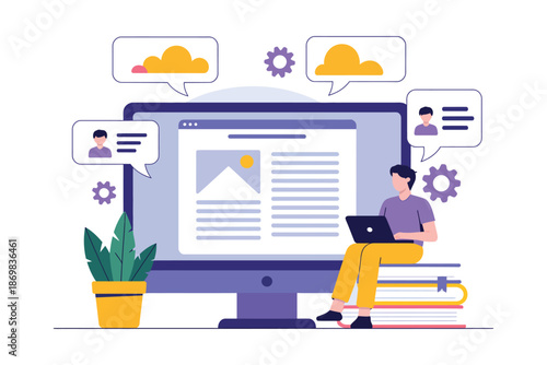 A man sits on a stack of books, working on a laptop in front of a large computer monitor with a website on the screen.