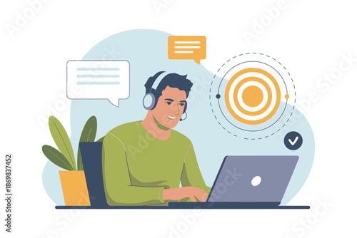 A man wearing a headset sits at a desk with a laptop and plant, engaged in online communication.