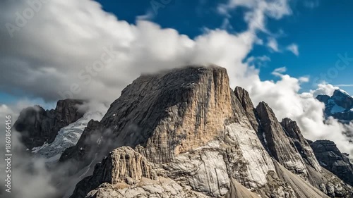 Wallpaper Mural Majestic Mountain Peak with Dramatic Clouds and Blue Sky, Alpine Landscape Torontodigital.ca