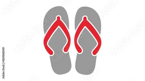 A pair of red flip flops on gray soles