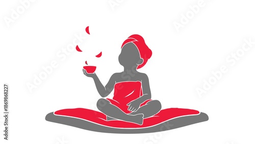 Woman in red towel sitting on mat with cup and petals relaxing