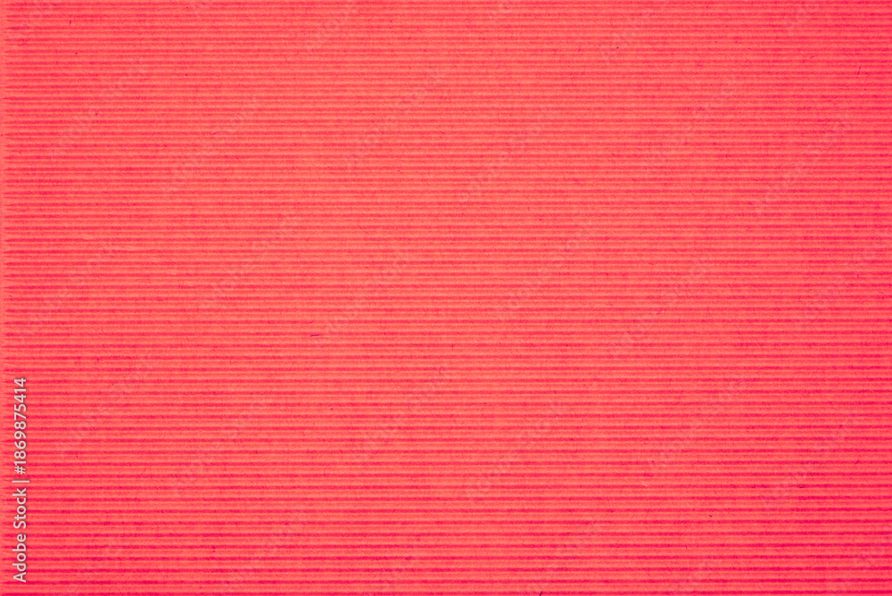 Fototapeta premium Corrugated cardboard background with red texture. Minimal recycled paper surface for eco design, packaging, craft projects, sustainability concepts and copy space.