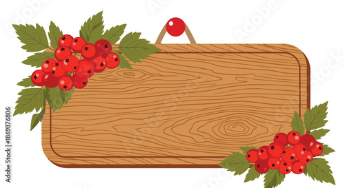 Empty wooden sign board decorated with clusters of red berries and green leaves for autumn or winter message.