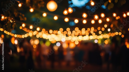 Wallpaper Mural A string of warm yellow lights hanging in a dark outdoor setting at night Torontodigital.ca