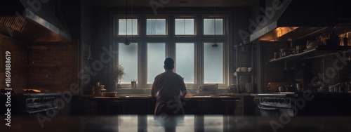 Chef in an Empty Kitchen with Soft Light Creating a Moment of Reflection and Serenity in a Fine Art Portrait Style