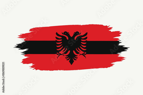 albania flag with red black brush paint strokes and eagle