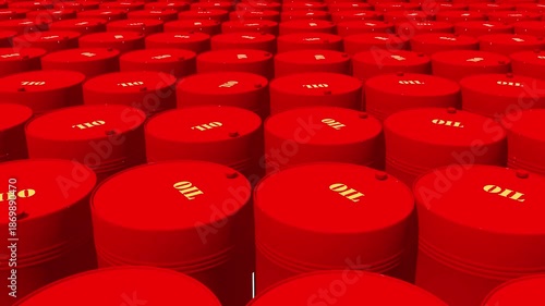 Group of red oil barrels near wastewater treatment area, showing signs of corrosion and usage. Industrial storage of hazardous materials.