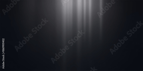 Light beams shining down on a dark background with a pixelated effect