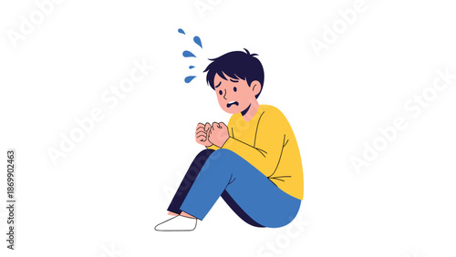 Depressed or anxious young boy sitting on the ground with a worried facial expression and sweat drops on his forehead.
