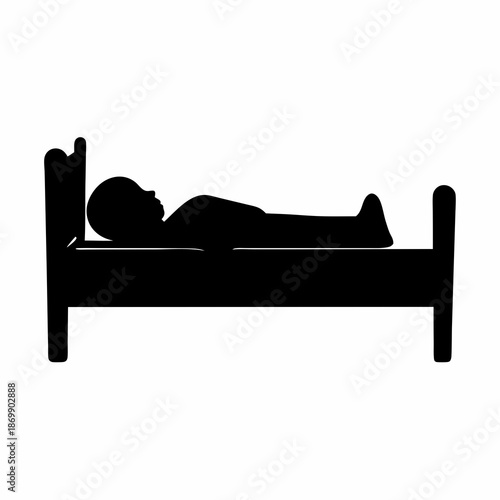 Silhouette of a person sleeping peacefully in a bed with ornate headboard