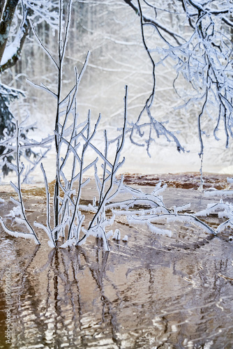 Flooding ice covered river in very cold winter day