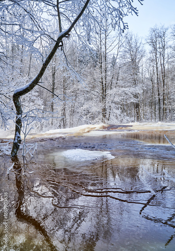 Flooding ice covered river in very cold winter day