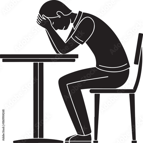 Sad person sitting alone at a table feeling depressed