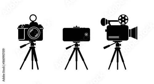 Three film cameras on tripods