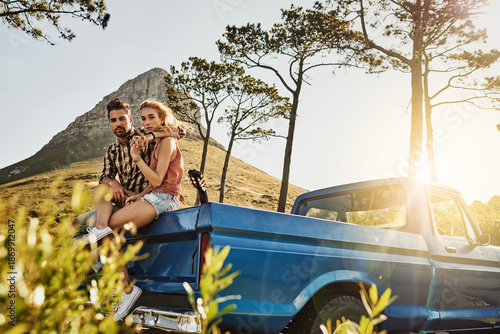 Tablou pe pânză Couple, portrait and relax with car in nature for summer holiday, vacation or outdoor weekend