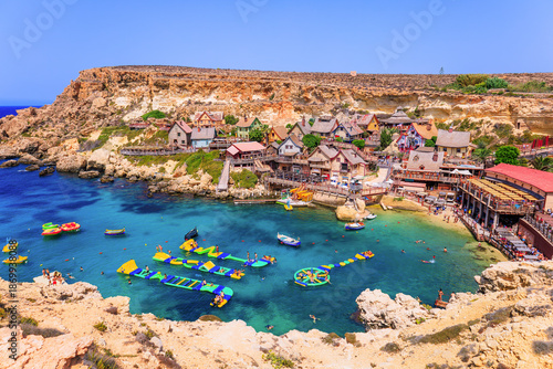 Traditional colorful houses in the famous Popeye Village at Anchor Bay, Il-Mellieha, Malta