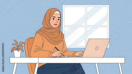A woman wearing a hijab sits at a desk working on a laptop
