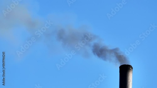 Industrial chimney emitting dark smoke, polluting air and environment in Moscow