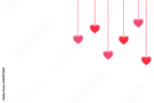 Minimalist Valentine's Day decoration with hanging red and pink hearts on white background with copy space