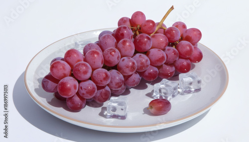 Wallpaper Mural "Red Grapes with Ice Cubes on White Plate – Fresh and Chilled Fruit Composition on White Background for Food, Nutrition, and Refreshment Concepts" Torontodigital.ca